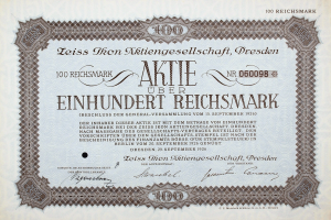 Altes deutsches Aktienzertifikat für 100 Reichsmark mit schwarzem Rand und gedrucktem Text.