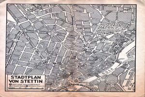 Ein detaillierter alter Stadtplan von Stuttgart auf einem Stück Papier, der Straßen, Gebäude und Sehenswürdigkeiten zeigt, mit zusätzlichem Text.