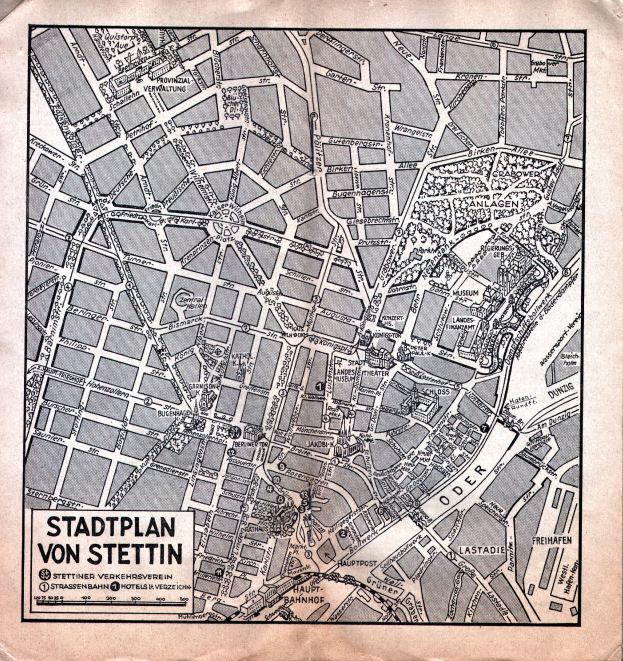 Ein detaillierter alter Stadtplan von Stuttgart auf einem Stück Papier, der Straßen, Gebäude und Sehenswürdigkeiten zeigt, mit zusätzlichem Text.